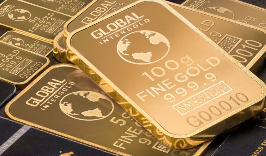 Gold bars with global trading text